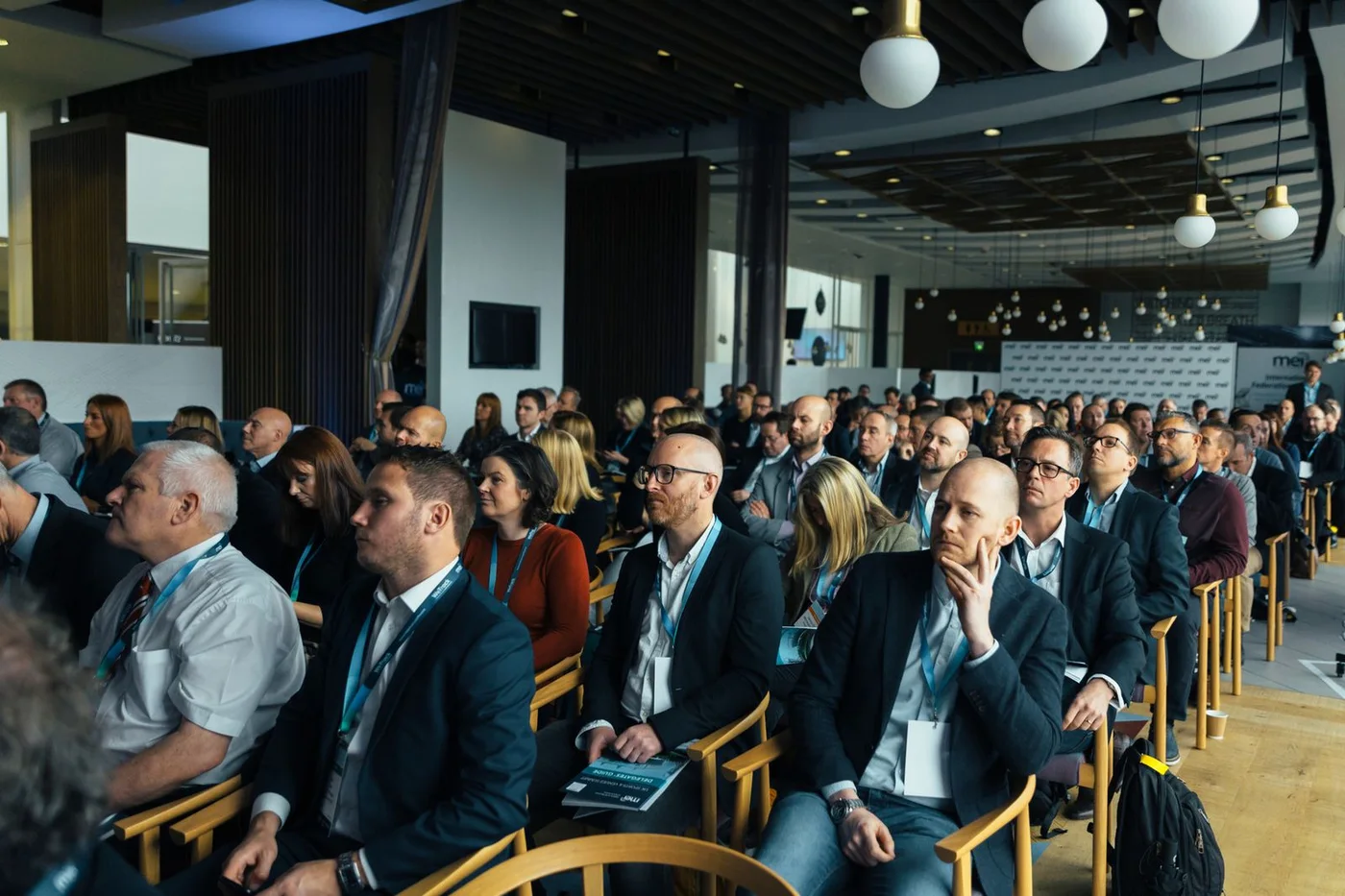 Crypto conference audience at a main stage session, where projects meet funds, exchanges and press