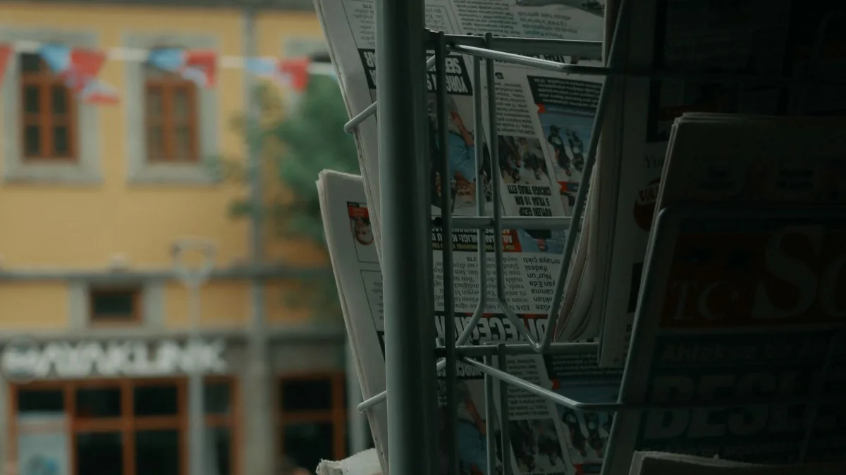 Newspapers on a street rack, the coverage a crypto press release agency sells